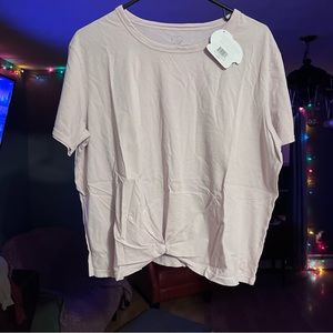 Brand new still in plastic tee shirt with twist front